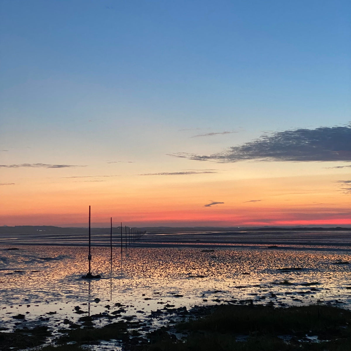 Sunset over the tidal flats at Holy Island of Lindisfarne